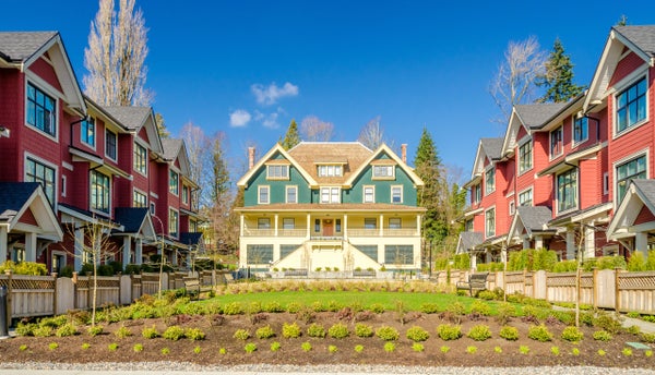 Exterior of a blue, multi-story, single-family home for sale in the city of Alexandria, Virginia