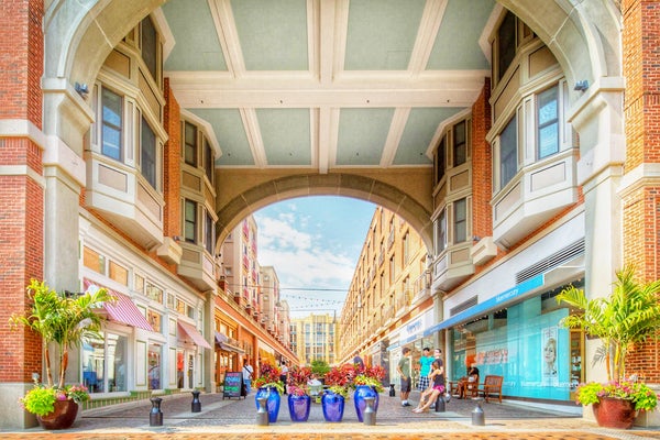 Sunny view of street with stores and apartments in the affluent neighborhood of Bethesda, Maryland