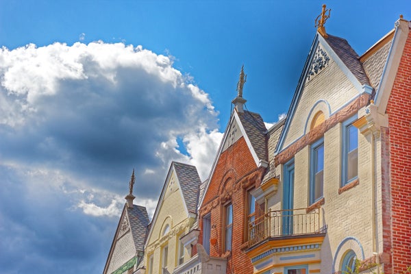 View of red and white brick row homes in the Washington, DC planned community of Burleith