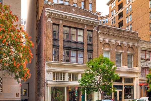 Small, historic loft apartment building with shops below in Central Washington, DC