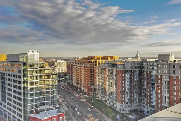 Street view during a beautiful sunset of Mt Vernon Square and condominiums for sale