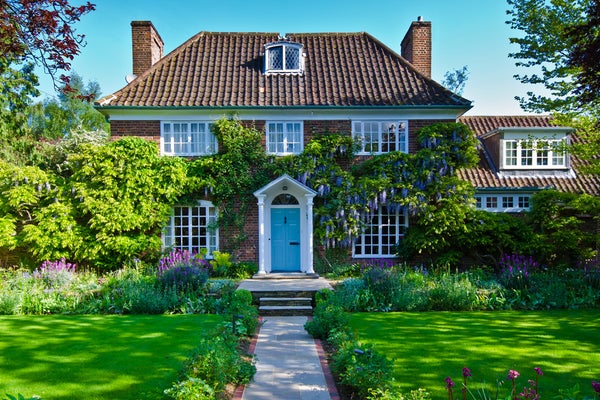 Beautiful luxury cottage estate with climbing vines and wisteria in the community of Potomac