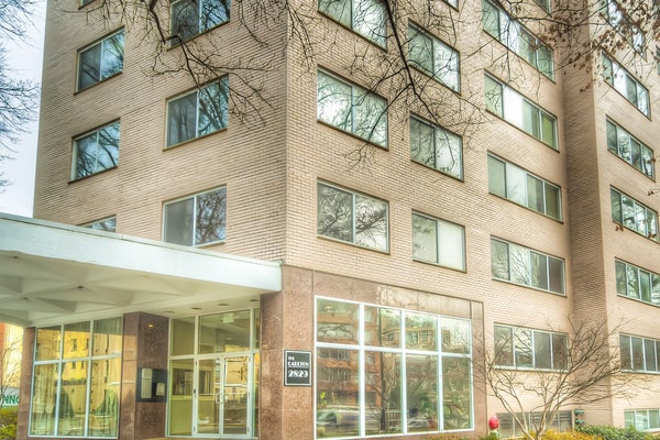 Exterior of a brown brick Woodley Park condominium, as typical of Washington, DC