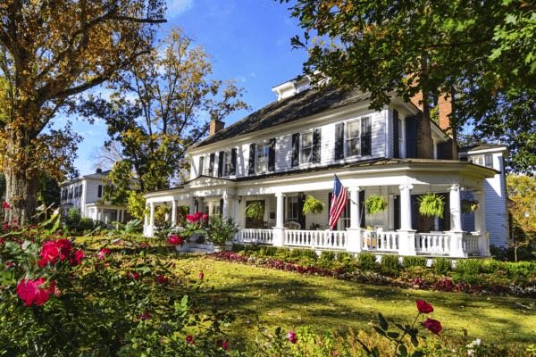 White Colonial style home for sale in Cleveland Park with view of garden